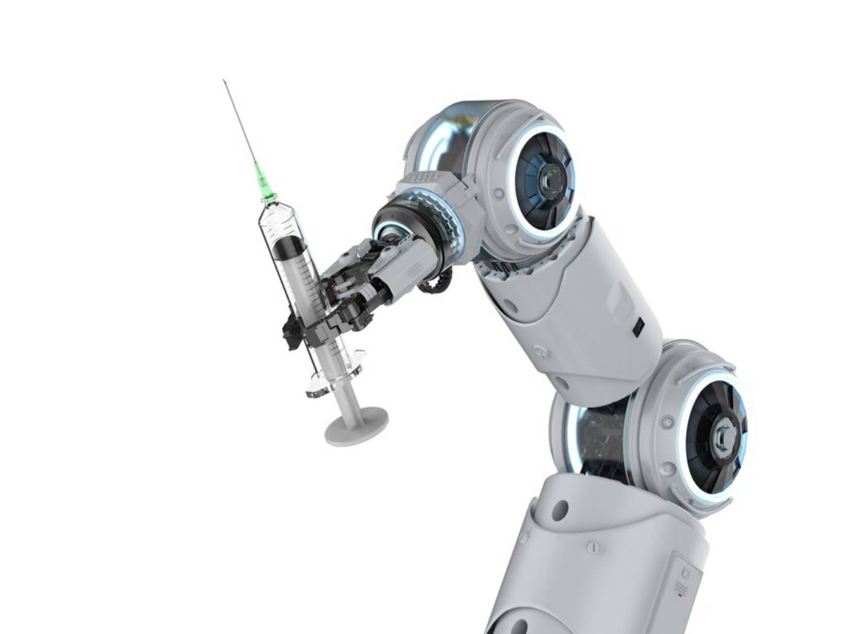 A robotic arm holds a syringe with a green cap, designed for medical applications