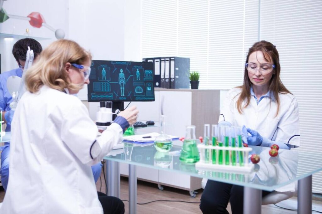 Team of different ages of scientist team in a research lab.