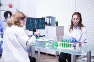 Team of different ages of scientist team in a research lab.